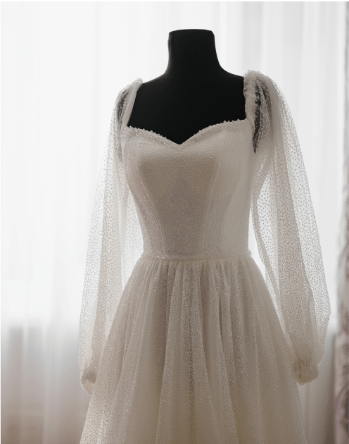 long sleeve wedding dress on a mannequin
