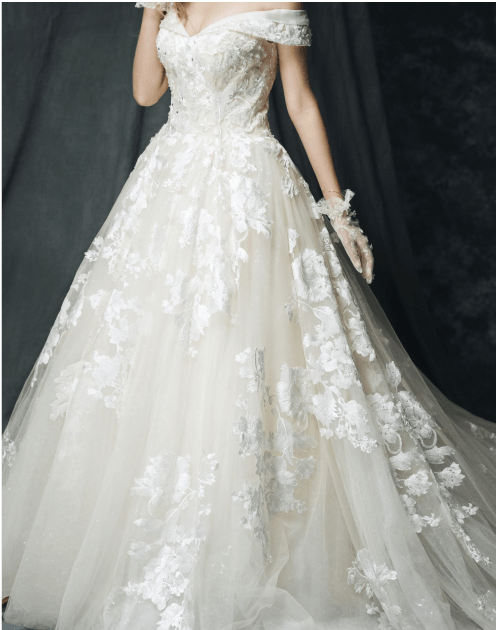 Floral A-Line Wedding dress on a woman standing in a room